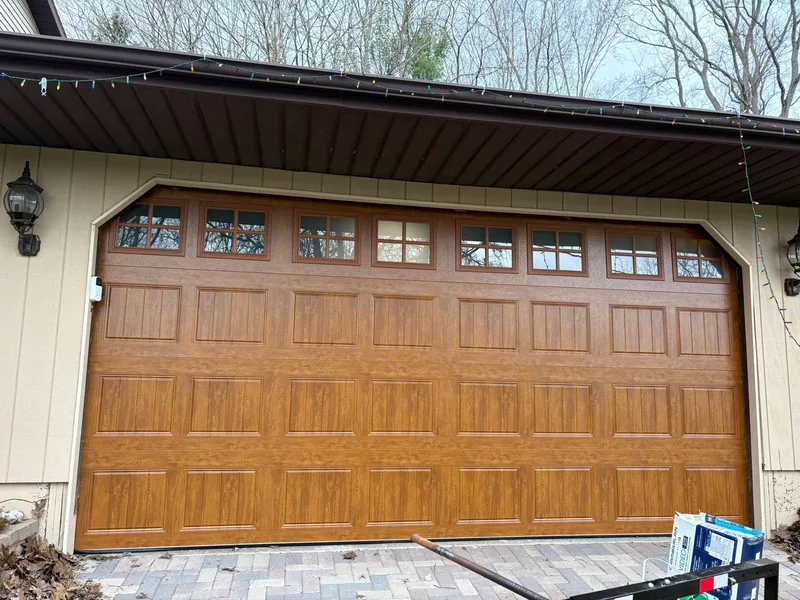 After — upgraded wood-look garage door installation